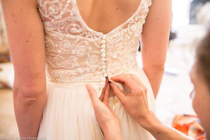 Low back wedding dress with buttons